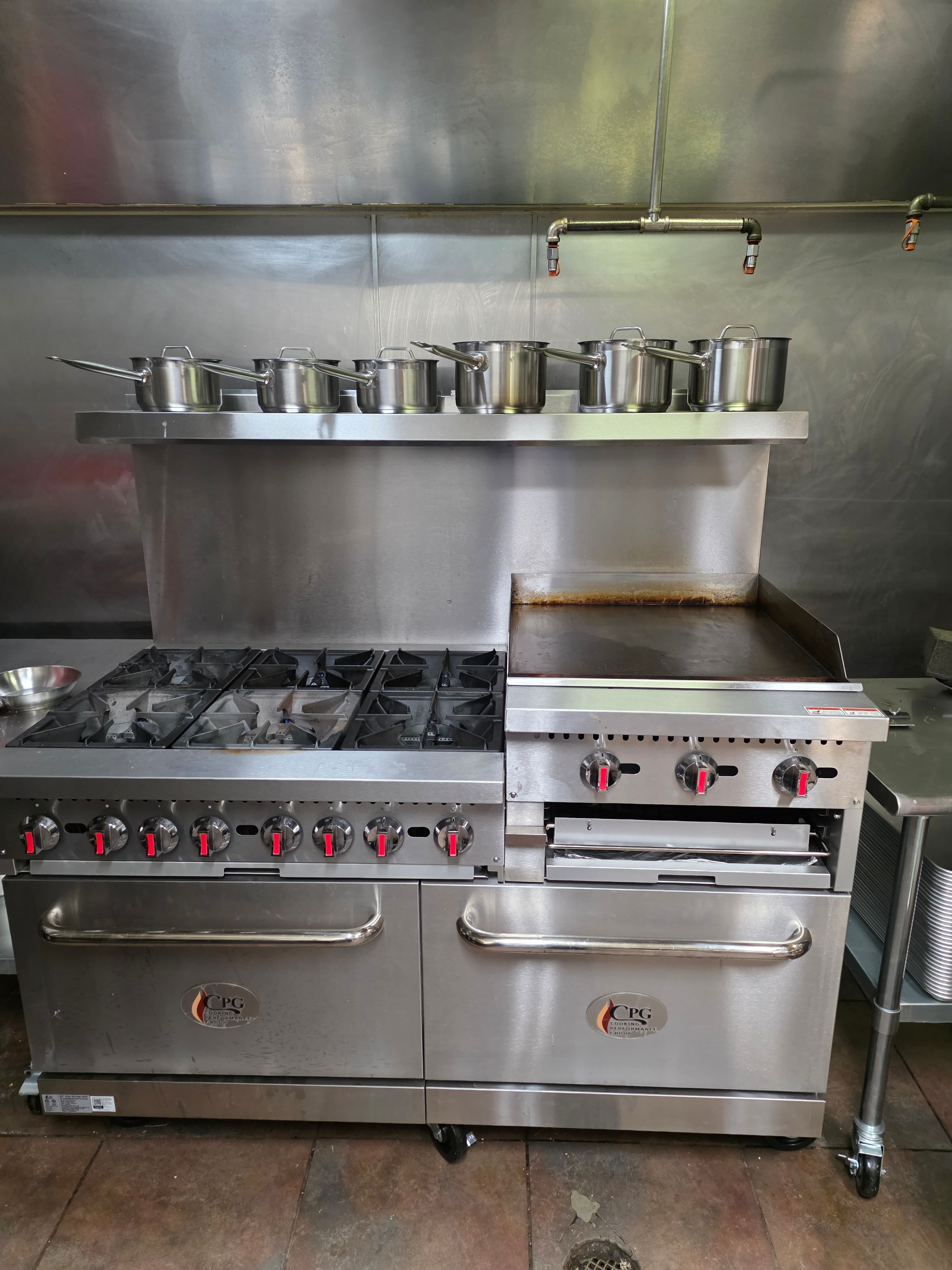 Commercial range and flat top at The Unseen Chef Studio