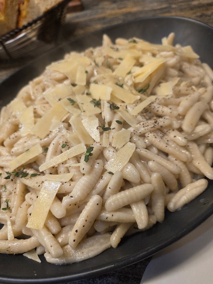 Fresh cavatelli pasta with shaved Parmesan